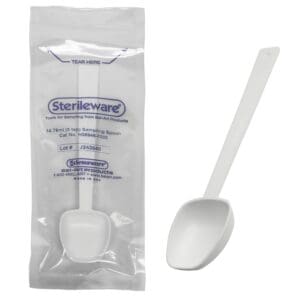 Sterile plastic spoon in sealed packaging.